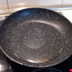 A ceramic Granitec pan, showing a dry spot at center—the result of thermocapillary convection.